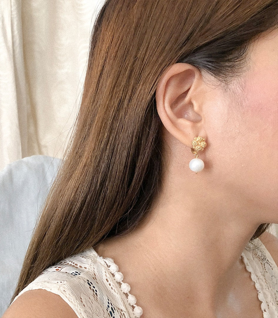 Estela Pearl Drop Earrings on a model - AMAMI