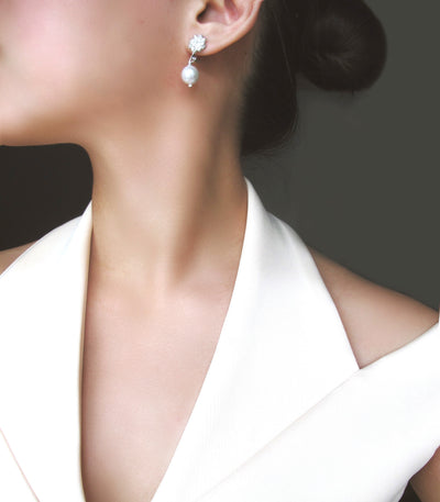 Estela Pearl Drop Earrings Silver on a model - AMAMI